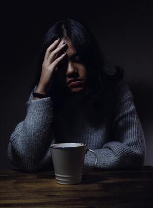 women suffering from migraine pain